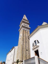 Low angle view of church against clear blue sky