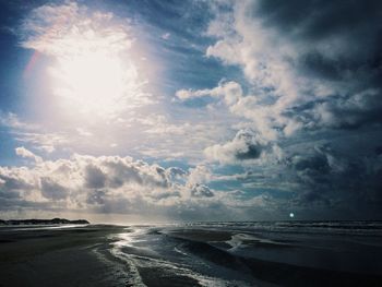 Scenic view of sea against cloudy sky