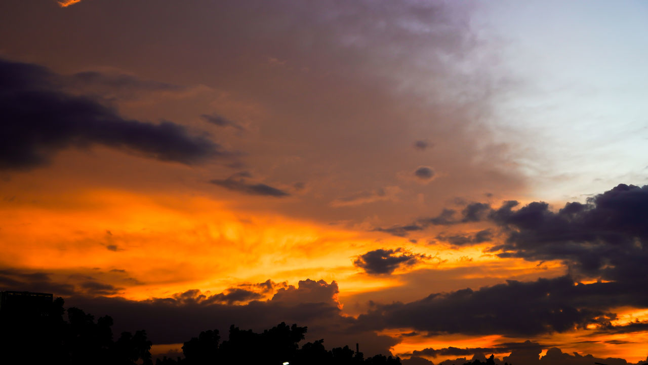 sky, cloud, sunset, afterglow, beauty in nature, scenics - nature, environment, dramatic sky, nature, orange color, red sky at morning, tranquility, silhouette, tranquil scene, landscape, evening, idyllic, cloudscape, tree, no people, dawn, multi colored, outdoors, sun, sunlight, horizon, atmospheric mood, yellow, travel, vibrant color, land, awe, travel destinations, twilight, plant, red, mountain, moody sky, non-urban scene, holiday, tourism, trip, backgrounds, dark, vacation, forest, light - natural phenomenon, atmosphere