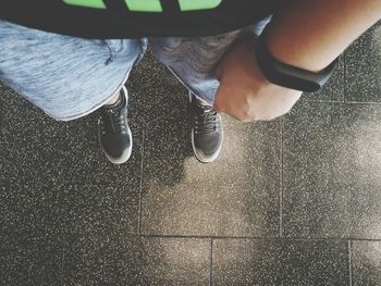 Low section of man standing on floor