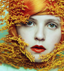 Close-up portrait of woman with plants