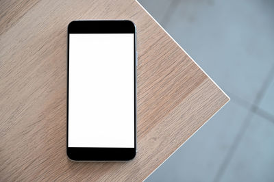 Low angle view of smart phone on table
