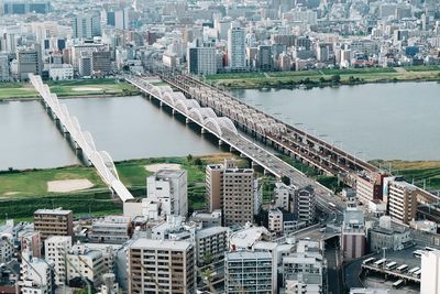 High angle view of river amidst buildings in city