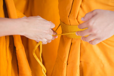 Close-up of hands during religious ceremony