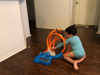 Boy playing with toy at home