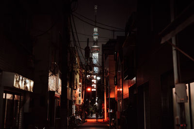 Illuminated city against sky at night