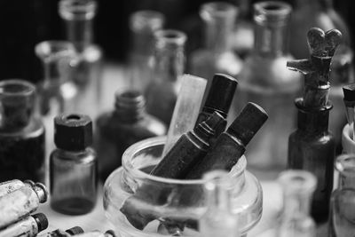 Close-up of wine bottles on table