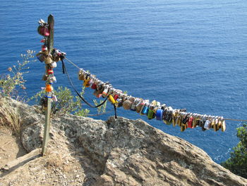 High angle view of people on rock by sea