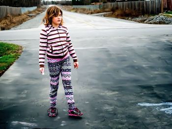 Full length of woman standing in water