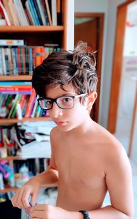 Portrait of shirtless boy at home