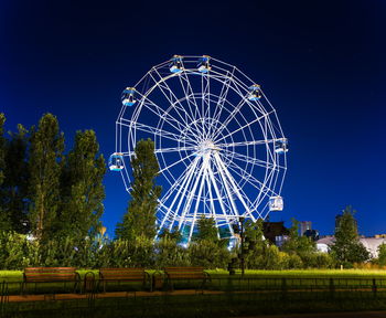 Low angle view of basketball hoop against sky at night