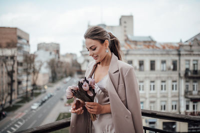 Young woman looking at city