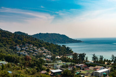 Scenic view of sea with cityscape in background