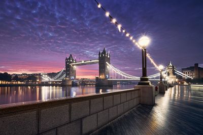 Popular travel destination - tower bridge against colorful sunrise.