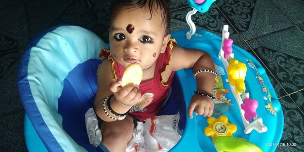 Portrait of cute girl with toys