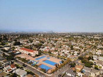 Aerial view over 54th street elementary with downtown los angeles skyline in the distance