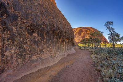 Rock formations on landscape against sky