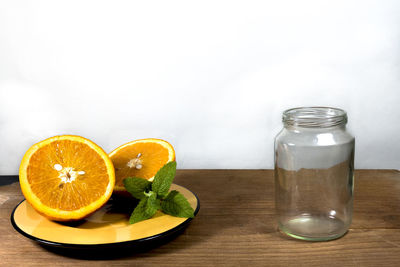 Close-up of drink served on table against white background