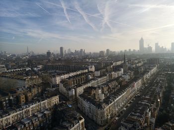 High angle view of city buildings against sky