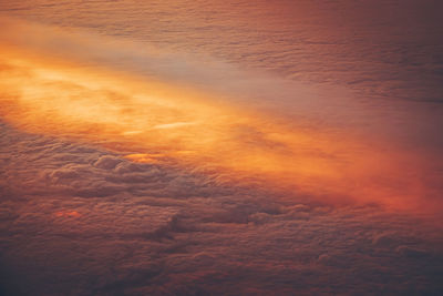 Aerial view of  clouds at sunset  out of an airplane 