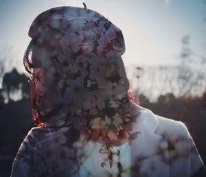 Multiple exposure of flowering plants and woman