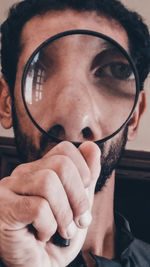 Close-up portrait of man wearing sunglasses