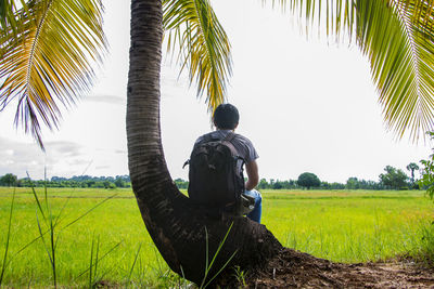 Man sitting on field