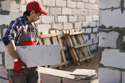 Side view of man working at home