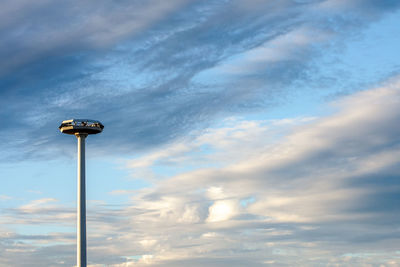 Low angle view of street light against sky