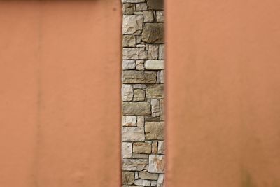 Full frame shot of stone wall with building