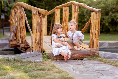 Women sitting on wood