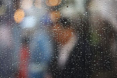 Full frame shot of raindrops on glass window