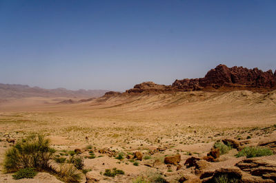 Scenic view of desert against clear sky