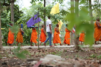 Group of people against trees