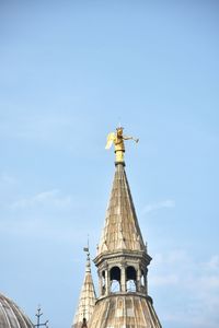 Low angle view of bell tower against sky