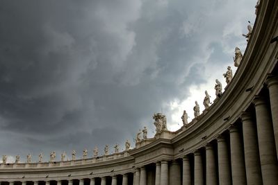 Low angle view of building against cloudy sky