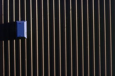 Blue alarm on the outside of an industrial warehouse in sheffield south yorkshire u.k.