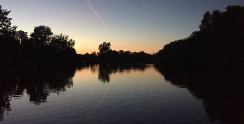 Scenic view of lake against sky during sunset