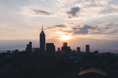 View of cityscape against sky during sunset