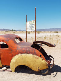 Abandoned vintage car on sunny day