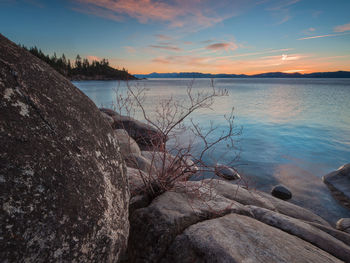 Scenic view of lake against sky during sunset