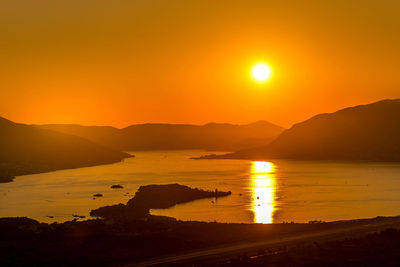 Scenic view of sea against romantic sky at sunset