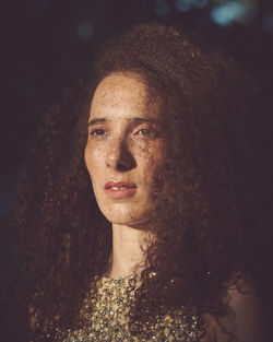 Close-up of woman with curly hair