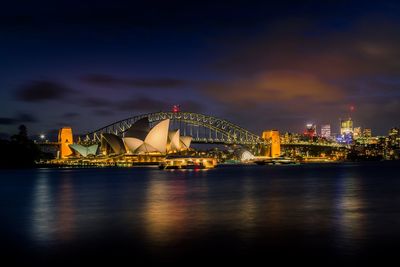 Illuminated city at waterfront