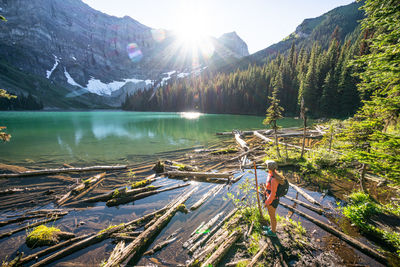 Hiker watching the sunset over rawson lake near serrail ridge