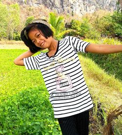 Portrait of girl standing on field