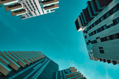 Low angle view of buildings against blue sky