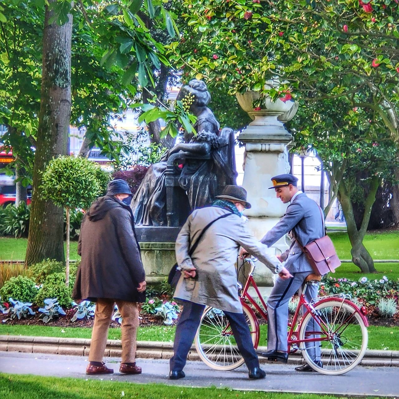 PEOPLE WITH BICYCLE ON TREE