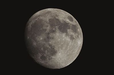 Low angle view of moon against sky at night