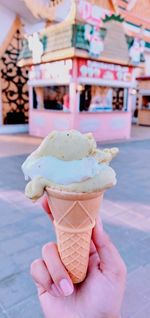 Cropped image of hand holding ice cream cone